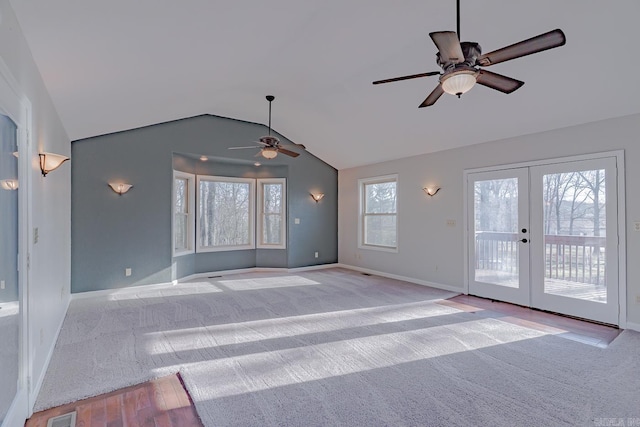 unfurnished living room with french doors, carpet, and ceiling fan