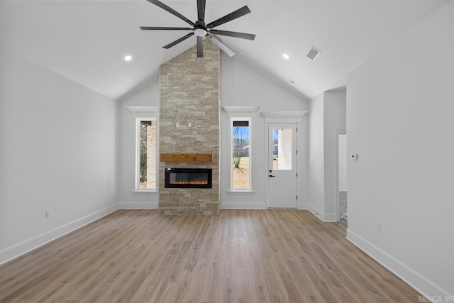 13505 Alexander Rd, Alexander, AR 72002 - unfurnished living room featuring visible vents, light wood-type flooring, a fireplace, high vaulted ceiling, and a ceiling fan