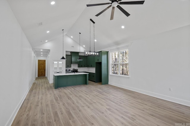 13505 Alexander Rd, Alexander, AR 72002 - kitchen with a center island with sink, light wood-style flooring, custom range hood, green cabinets, and ceiling fan with notable chandelier