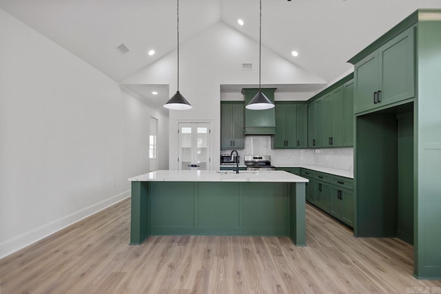 13505 Alexander Rd, Alexander, AR 72002 - kitchen with light wood finished floors, stainless steel range with electric cooktop, green cabinets, and a sink