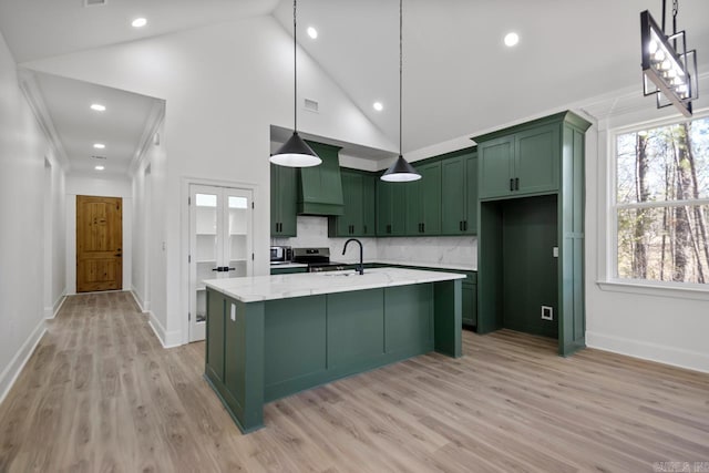 13505 Alexander Rd, Alexander, AR 72002 - kitchen with stainless steel electric stove, a healthy amount of sunlight, and green cabinets