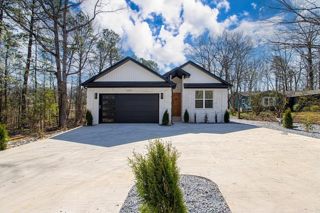 13505 Alexander Rd, Alexander, AR 72002 - view of front of house with a garage, brick siding, and driveway