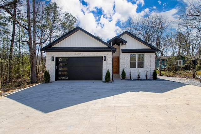 13505 Alexander Rd, Alexander, AR 72002 - view of front of property with brick siding, concrete driveway, and a garage