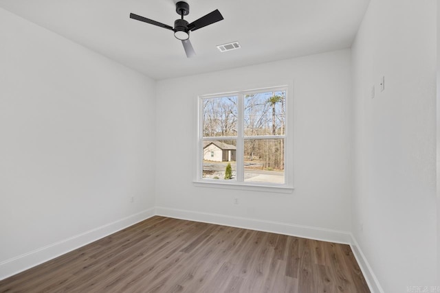 13505 Alexander Rd, Alexander, AR 72002 - spare room featuring visible vents, ceiling fan, baseboards, and wood finished floors
