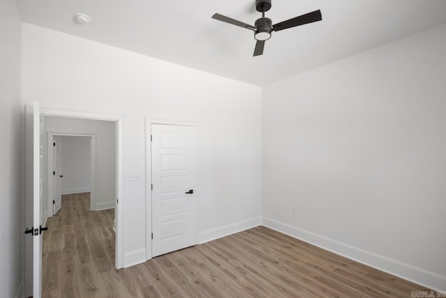 13505 Alexander Rd, Alexander, AR 72002 - spare room featuring wood finished floors, a ceiling fan, and baseboards