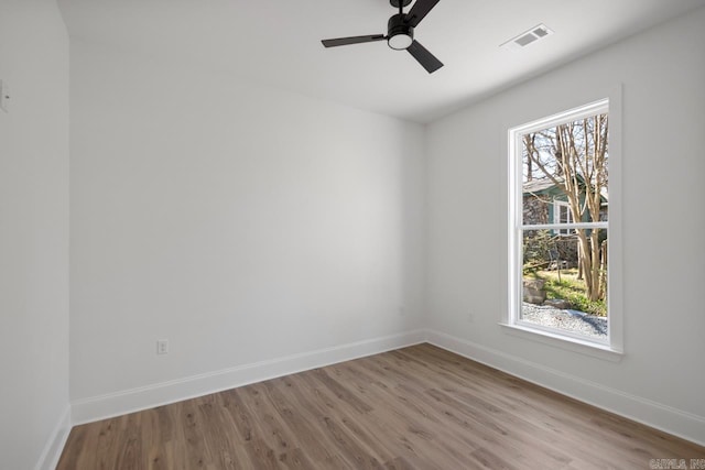 13505 Alexander Rd, Alexander, AR 72002 - spare room with a ceiling fan, wood finished floors, visible vents, and baseboards