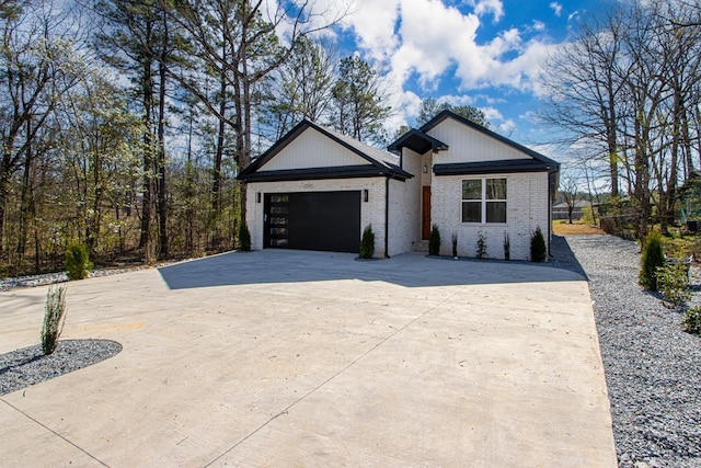 13505 Alexander Rd, Alexander, AR 72002 - view of front facade with brick siding, a garage, and driveway