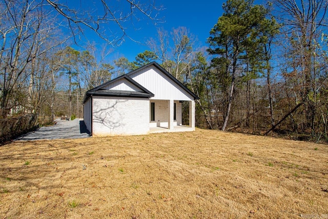 13505 Alexander Rd, Alexander, AR 72002 - exterior space featuring a lawn and brick siding