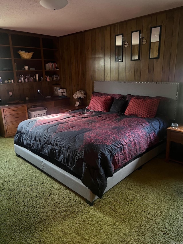 carpeted bedroom featuring wood walls