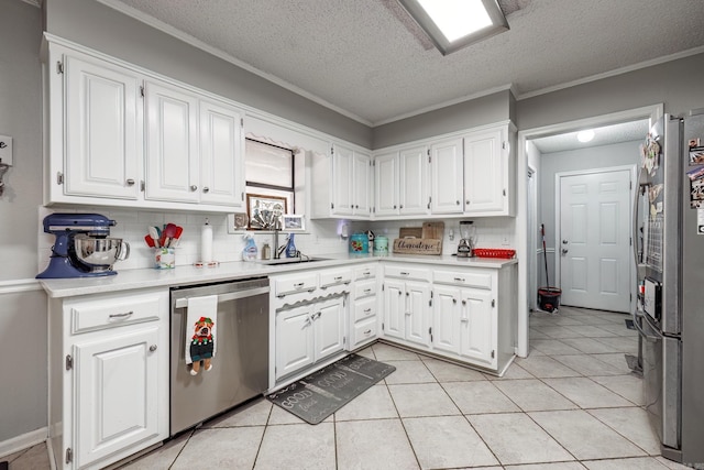 2304 Forrest Park Dr, Arkadelphia, AR 71923 - kitchen with light tile patterned floors, white cabinets, stainless steel appliances, and light countertops