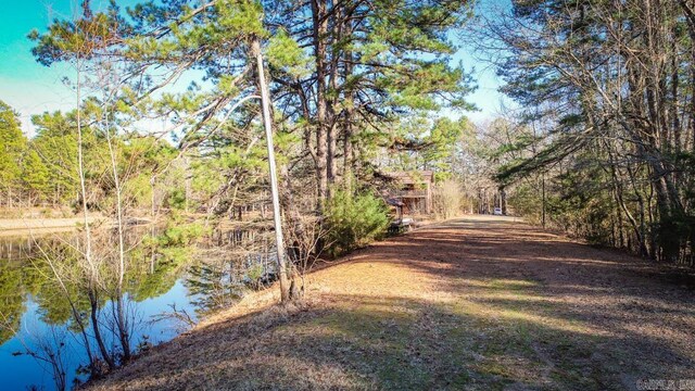 exterior space featuring a forest view