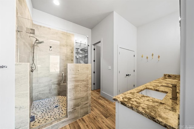 1601 Marion Anderson Rd, Hot Springs, AR 71913 - full bathroom with a sink, wood finished floors, a stall shower, and double vanity
