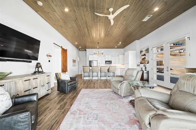 1601 Marion Anderson Rd, Hot Springs, AR 71913 - living room featuring dark wood-style floors, recessed lighting, ornamental molding, wood ceiling, and a barn door