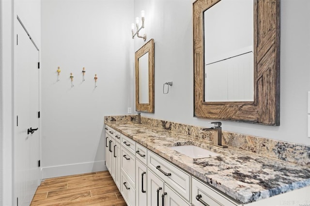 1601 Marion Anderson Rd, Hot Springs, AR 71913 - bathroom featuring a sink, baseboards, wood finished floors, and double vanity