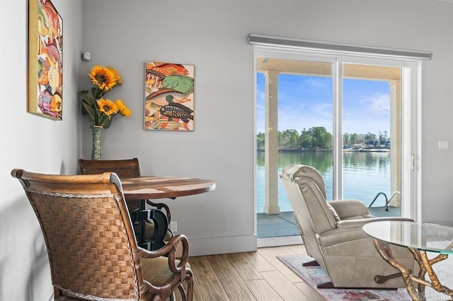 1601 Marion Anderson Rd, Hot Springs, AR 71913 - dining area with a water view, baseboards, and wood finished floors