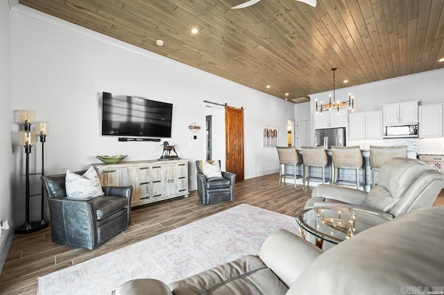 1601 Marion Anderson Rd, Hot Springs, AR 71913 - living room with dark wood finished floors, wooden ceiling, a barn door, and a chandelier
