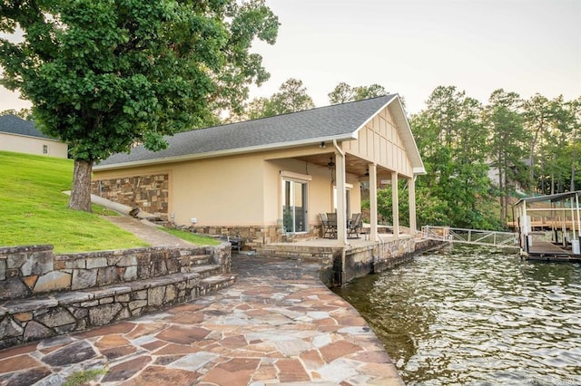 1601 Marion Anderson Rd, Hot Springs, AR 71913 - view of side of home with a yard, a patio area, stone siding, and stucco siding