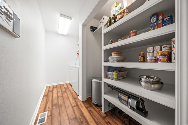 pantry featuring visible vents and washer and clothes dryer