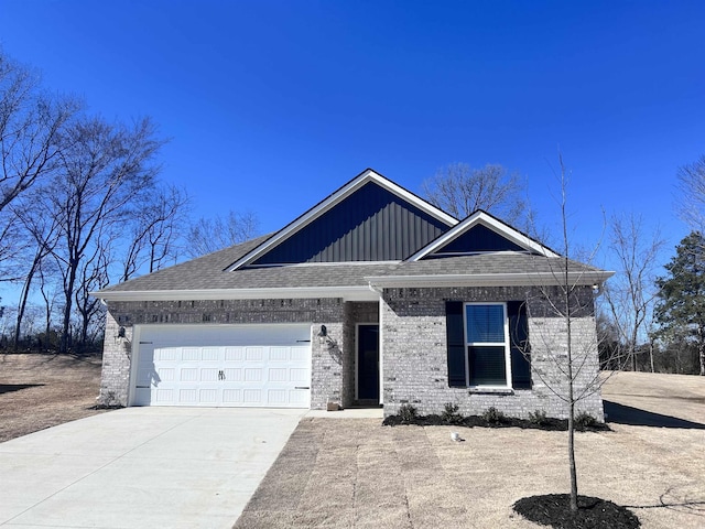 view of front facade with brick siding, concrete driveway, a garage, and a shingled roof