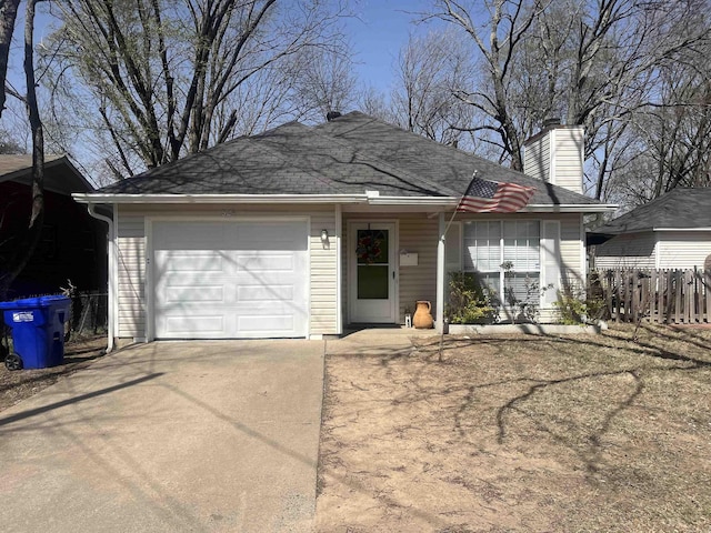 ranch-style house featuring an attached garage, fence, driveway, and a chimney