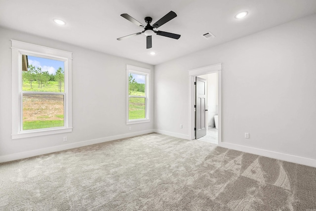 carpeted empty room featuring baseboards, a ceiling fan, and recessed lighting