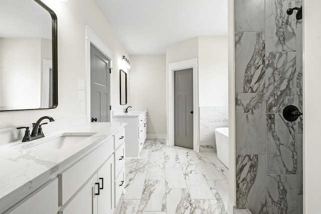 full bathroom featuring marble finish floors, two vanities, a soaking tub, a marble finish shower, and baseboards
