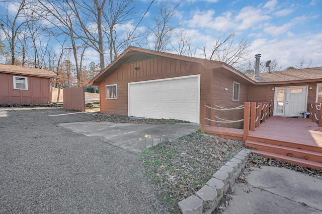 120 Lisa Blvd, Greers Ferry, AR 72067 - exterior space featuring a detached garage, a deck, and fence