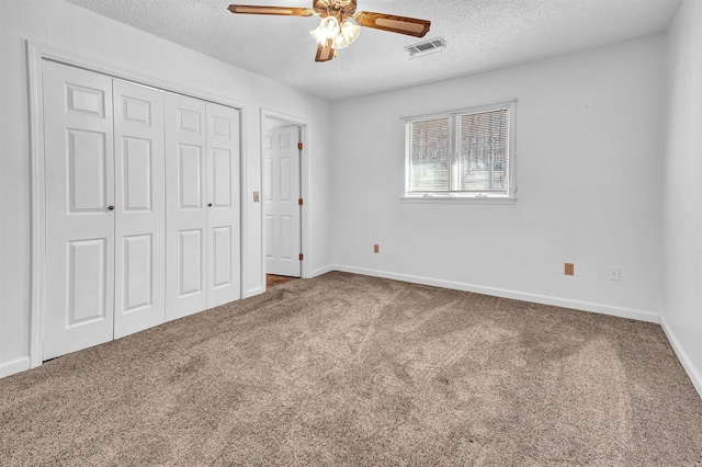 120 Lisa Blvd, Greers Ferry, AR 72067 - unfurnished bedroom with a closet, a textured ceiling, visible vents, and carpet flooring