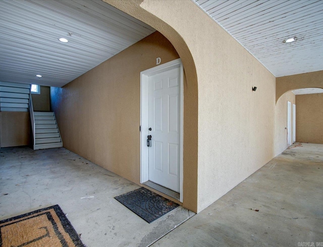 entrance to property with stucco siding