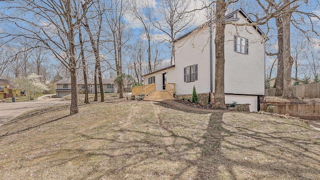 exterior space with fence and a garage