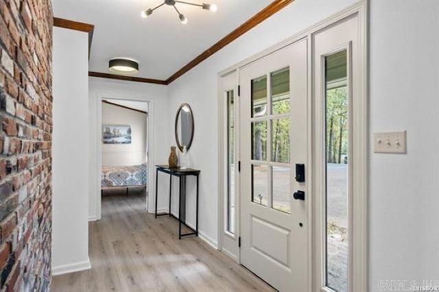 103 River Bend Rd, Hot Springs, AR 71913 - foyer entrance featuring an inviting chandelier, crown molding, light wood-style flooring, and baseboards