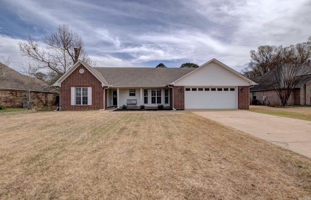 single story home with a front lawn, roof with shingles, concrete driveway, an attached garage, and brick siding