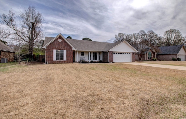 ranch-style house with brick siding, an attached garage, concrete driveway, and a front lawn