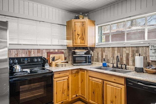205 Ledgerock, Hot Springs, AR 71913 - kitchen featuring wood walls, black appliances, and a sink