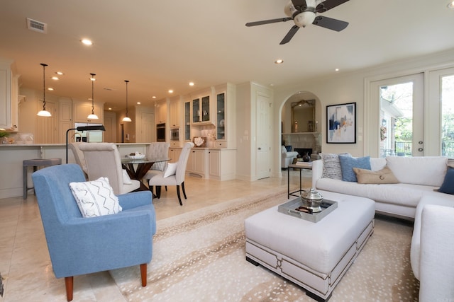 33 Greathouse Bend Dr, Little Rock, AR 72207 - living area with arched walkways, visible vents, recessed lighting, a ceiling fan, and light tile patterned floors