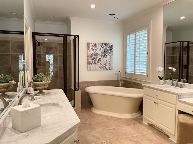 33 Greathouse Bend Dr, Little Rock, AR 72207 - bathroom with a freestanding bath, a stall shower, recessed lighting, and a sink
