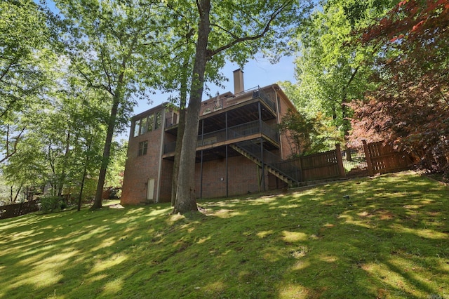 33 Greathouse Bend Dr, Little Rock, AR 72207 - back of house with a chimney, fence, stairs, a deck, and a yard