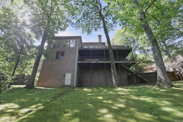 33 Greathouse Bend Dr, Little Rock, AR 72207 - back of house featuring a lawn, stairway, a deck, and brick siding