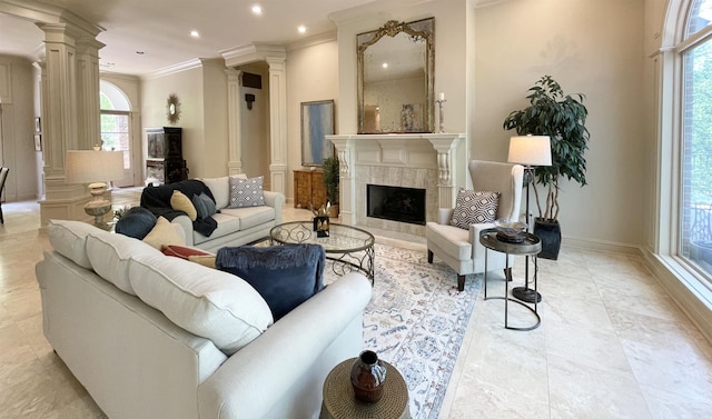 33 Greathouse Bend Dr, Little Rock, AR 72207 - living area featuring a high end fireplace, a wealth of natural light, ornamental molding, and decorative columns