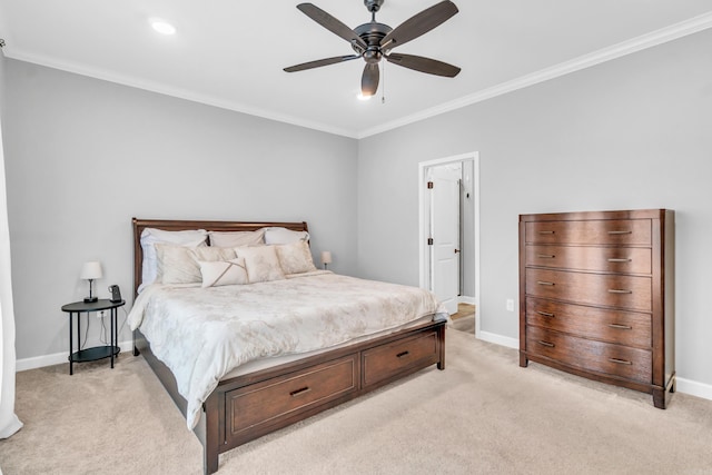 bedroom with baseboards, light colored carpet, ceiling fan, and crown molding