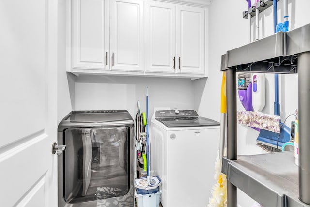 laundry area featuring cabinet space and independent washer and dryer