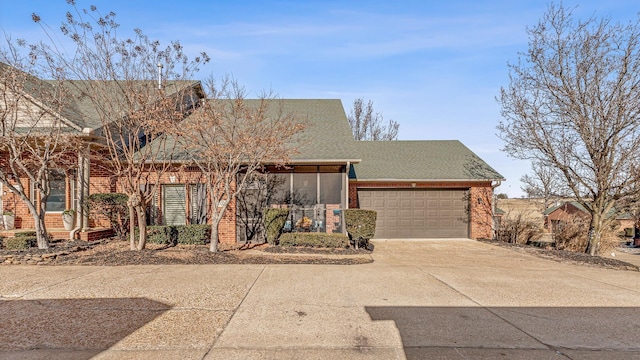 4000 Ridgepointe Cv, Jonesboro, AR 72404 - view of front of property with an attached garage, brick siding, and driveway