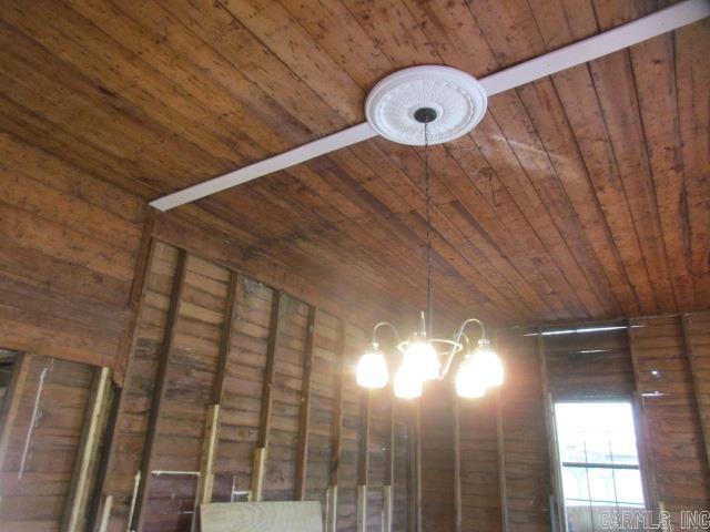 410 E Magnolia St, Rison, AR 71665 - details featuring an inviting chandelier and wood ceiling
