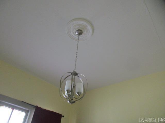 410 E Magnolia St, Rison, AR 71665 - interior details featuring a notable chandelier