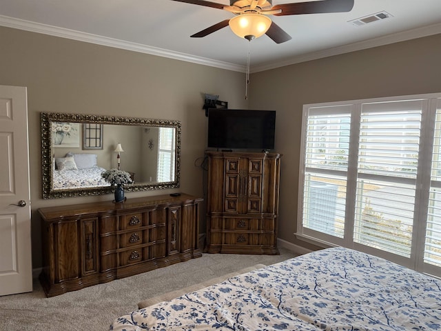 bedroom featuring visible vents, carpet flooring, crown molding, and ceiling fan