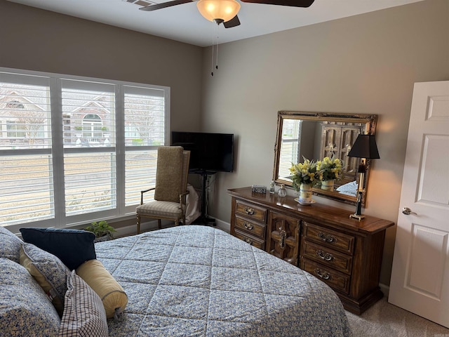 bedroom featuring carpet flooring, baseboards, and ceiling fan