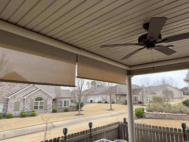 view of patio / terrace featuring a fenced front yard, a residential view, and ceiling fan