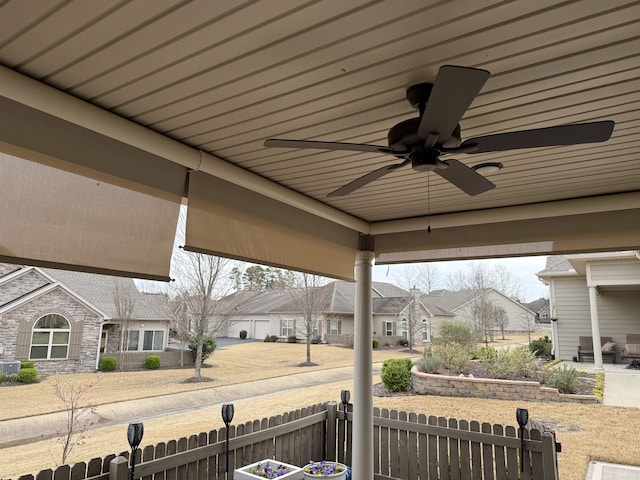 view of patio / terrace featuring a fenced front yard, a residential view, and ceiling fan