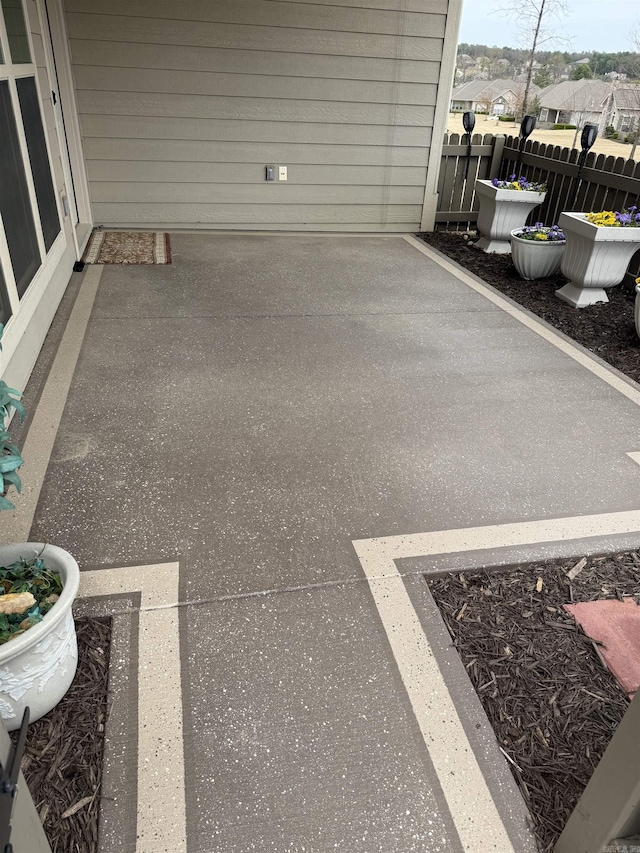 view of patio featuring fence