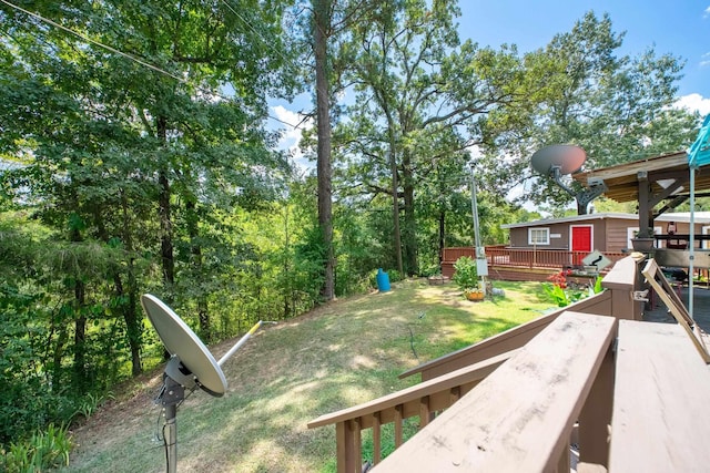 view of yard featuring a wooden deck